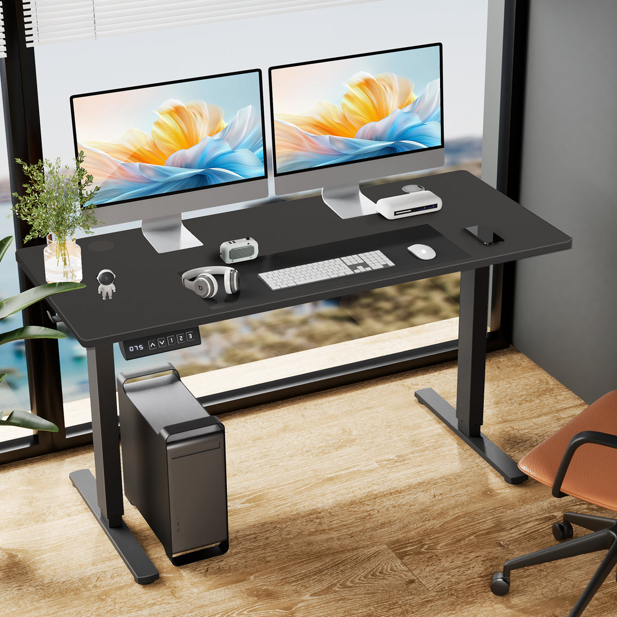 Electric Standing Desk, 63 x 24 in, black, with two monitors in a home office