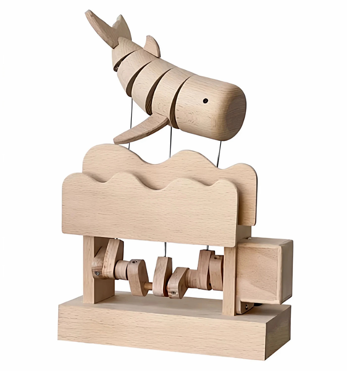 The whale automaton on a white background: the striped whale on wires, the wave-topped beech box and the cams below.