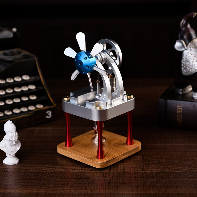 Metal Stirling engine with a blue propeller hub on red legs and a bamboo base