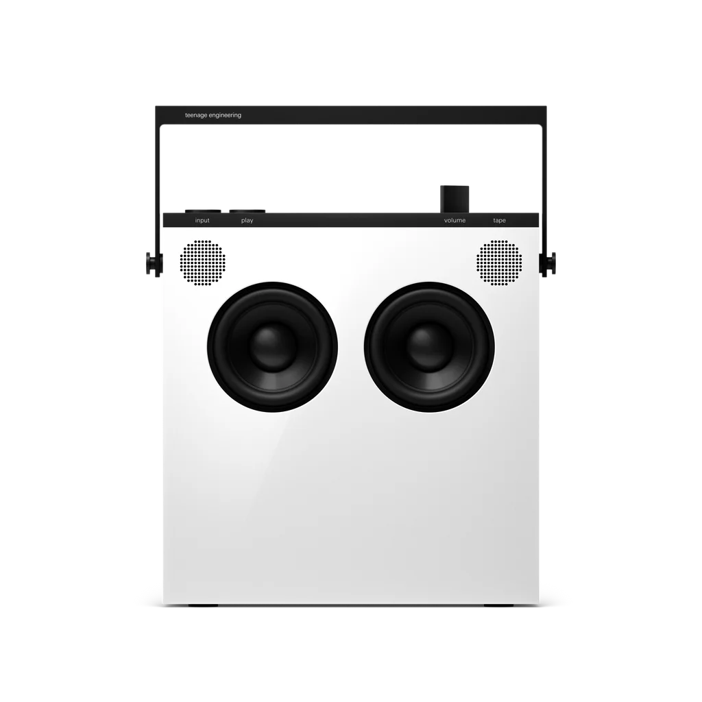 White OB-4 speaker seen from the front with two round woofers and a top handle