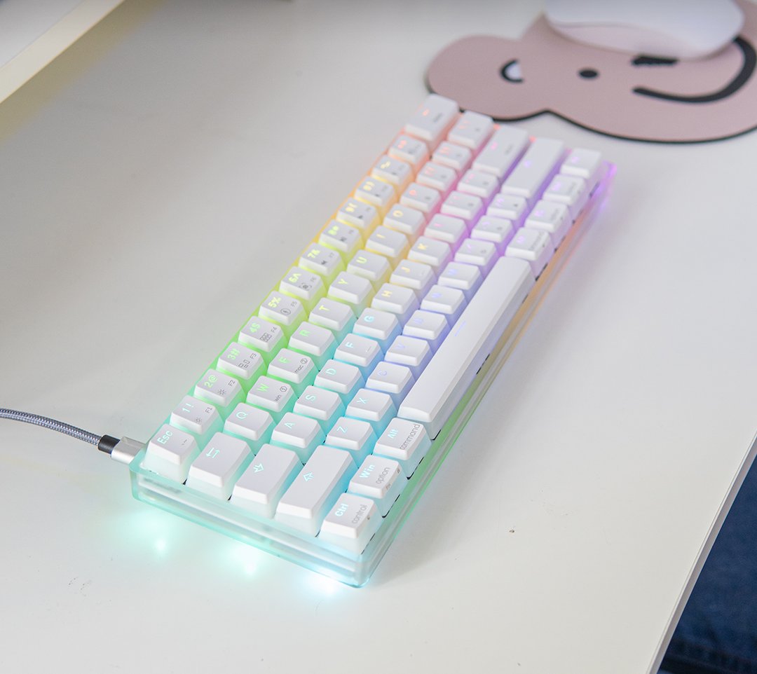 White RGB backlit mechanical keyboard on a white desk