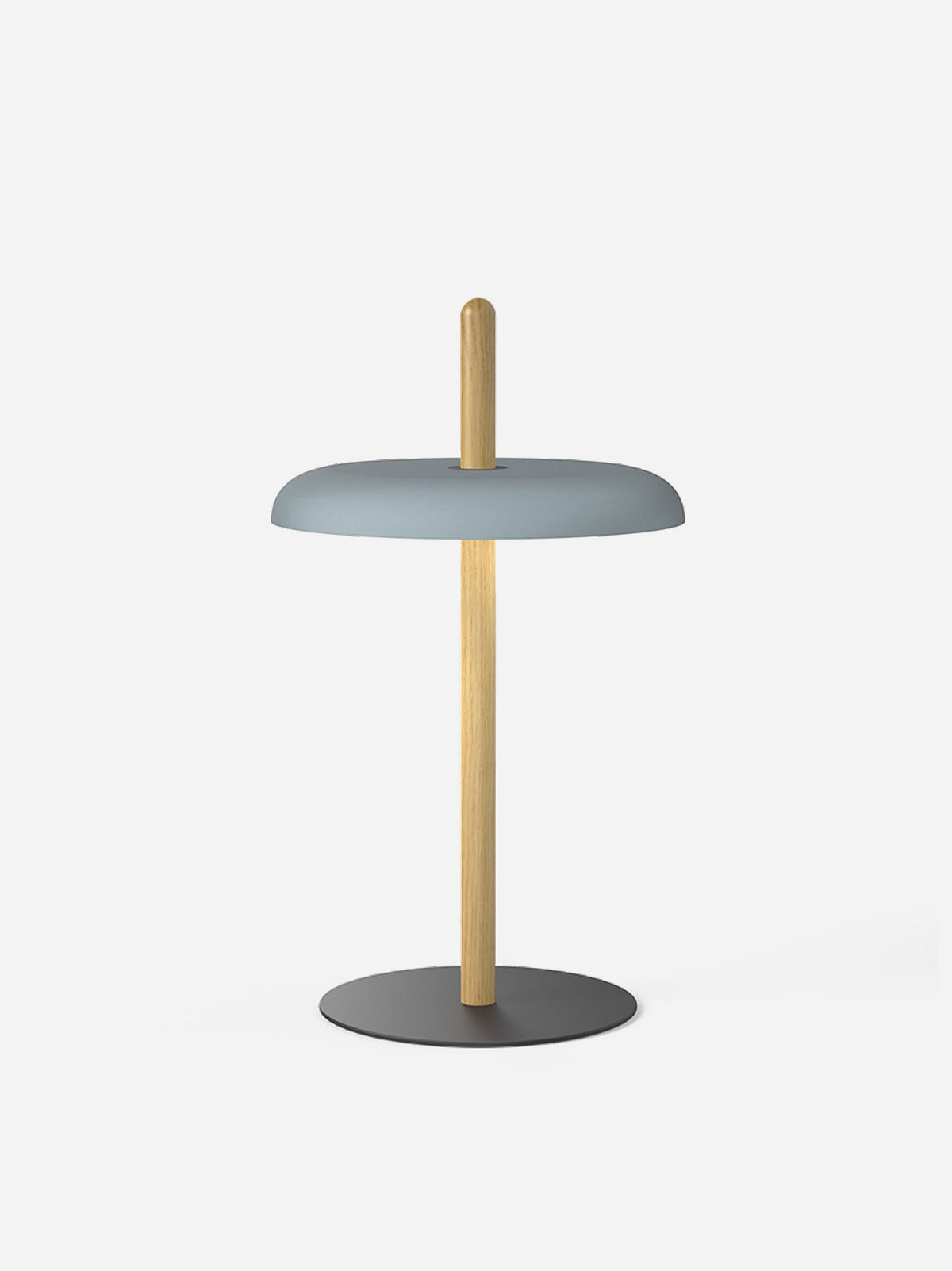 A slate blue shade on the oak post of the Nivel lamp against a light background