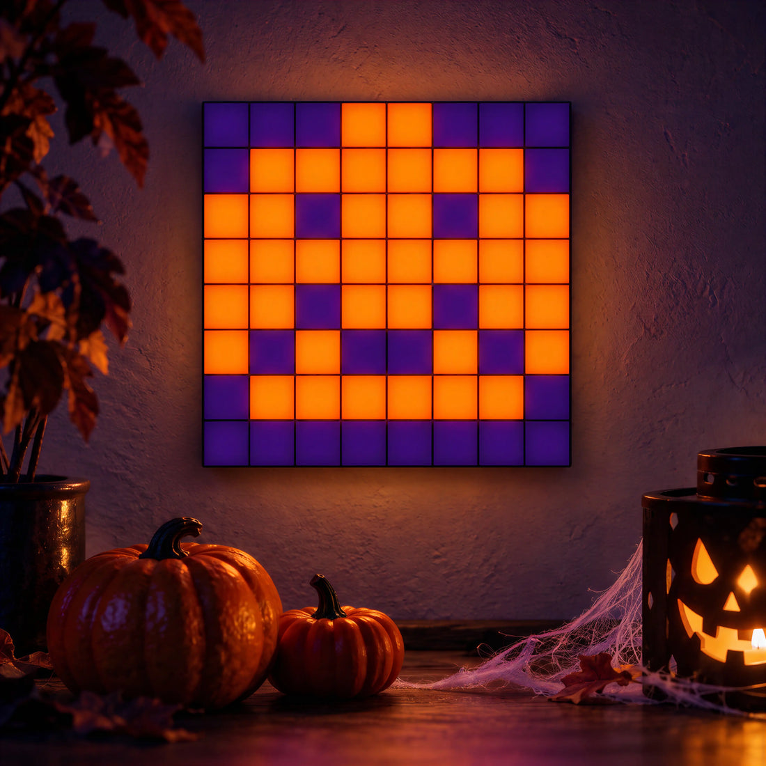 A square panel grid showing an orange jack-o-lantern pixel design beside pumpkins