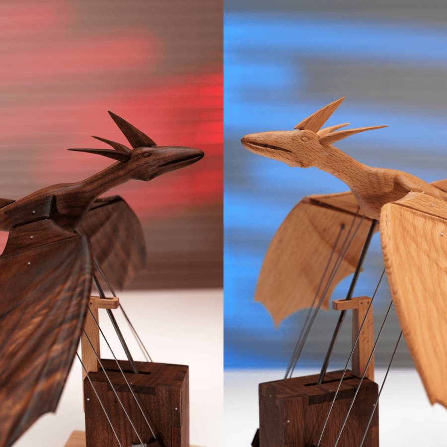 A dark dragon and a pale dragon side by side on their towers, red and blue light behind.