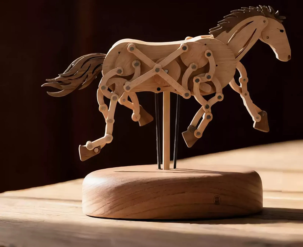 The wooden horse on its round base on a wooden table, mid-stride, dark background.