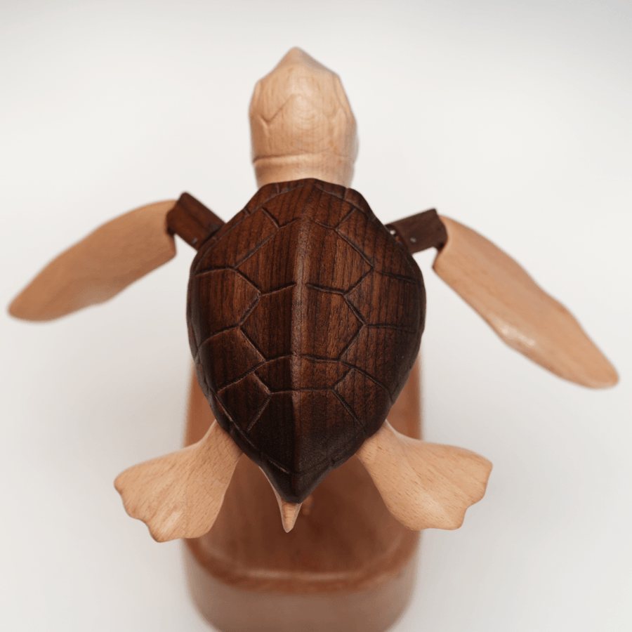 Sea turtle automaton seen from above, shell centred with all four flippers out on a white background.